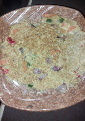 A picture of Fried indomie with egg and vegetables.