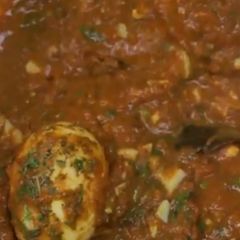 A picture of Eggs in Tomato gravy.