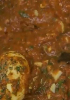 A picture of Eggs in Tomato gravy.