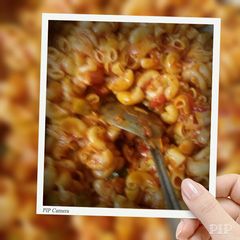 A picture of Red gravy pasta.