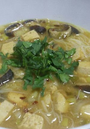 A picture of Shitake miso soup with ginger and lime.