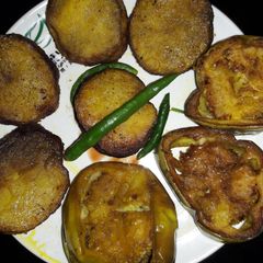 Fried potatoes and brinjals A picture of Fried potatoes and brinjals.