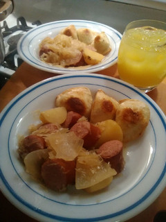 A picture of Sauerkraut and polish kielbasa.