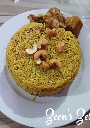 A picture of Chicken Maqlooba/Palestinian Flipped Upside Down Rice Dish.