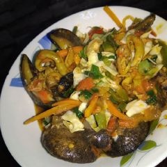 Snails in stir fried veggie gravy A picture of Snails in stir fried veggie gravy.