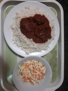 A picture of White Rice with coleslaw.