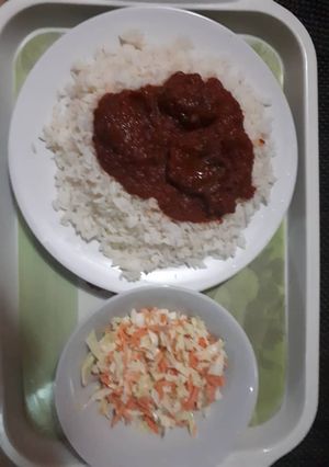 A picture of White Rice with coleslaw.