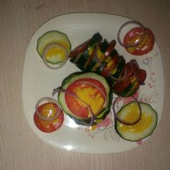A picture of Tomato cucumber salad.