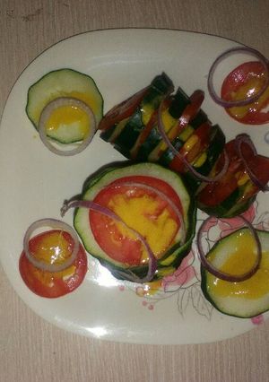 A picture of Tomato cucumber salad.
