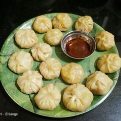 Veg Cheese Momos with Pasta Sauce n Shejwan Sauce A picture of Veg Cheese Momos with Pasta Sauce n Shejwan Sauce.