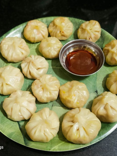 A picture of Veg Cheese Momos with Pasta Sauce n Shejwan Sauce.