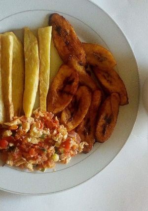 A picture of Fried yam,plantain and scrambled eggs with oats.