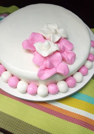 A picture of Pineapple cake with fondant icing.