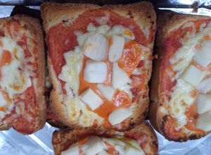 Una foto de Pan lactal tipo pizza de palmito