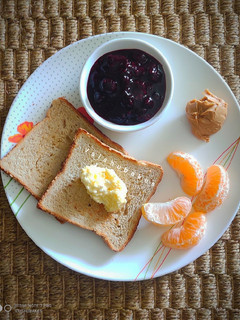 A picture of Continental Breakfast With Homemade Berry jam and Peanut Butter.