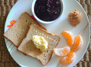 A picture of Continental Breakfast With Homemade Berry jam and Peanut Butter.