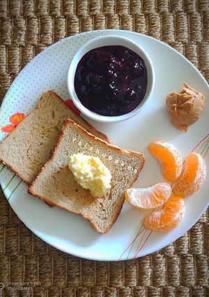 A picture of Continental Breakfast With Homemade Berry jam and Peanut Butter.
