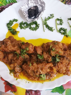 A picture of Mutton masala dhuwan gosht.