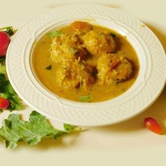 A picture of Turnip paruppu urundai kuzhambu (turnip dal dumplings masala curry).