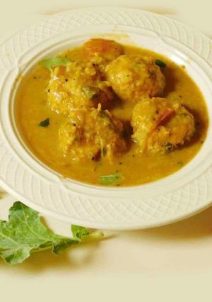 A picture of Turnip paruppu urundai kuzhambu (turnip dal dumplings masala curry).