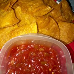 A picture of Restaurant style yellow corn tortilla chips.