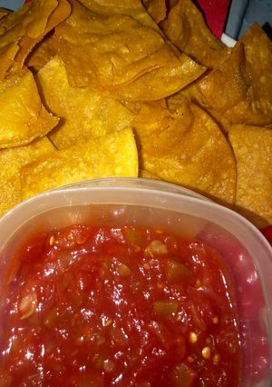 A picture of Restaurant style yellow corn tortilla chips.