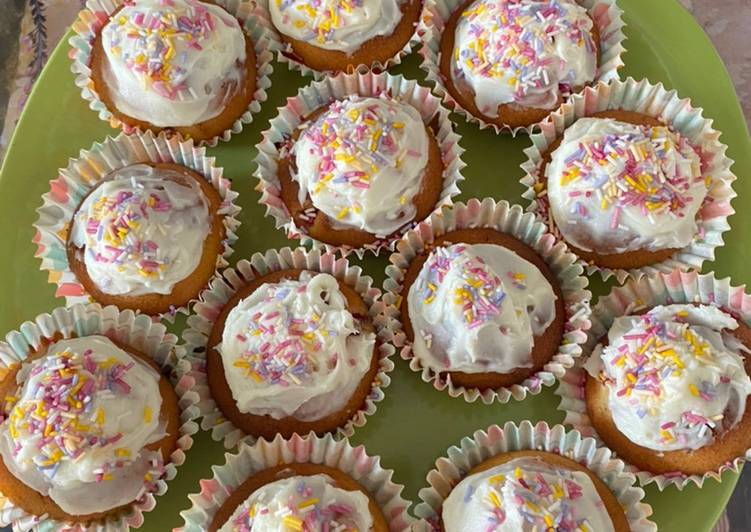 Strawberry cupcakes with vanilla frosting and sprinkles