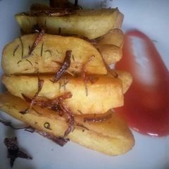 A picture of Buttered rosemary potato wedges.