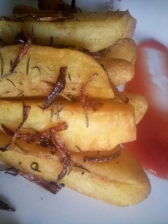 A picture of Buttered rosemary potato wedges.