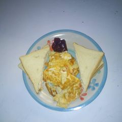 A picture of Bread and omellete with jam.