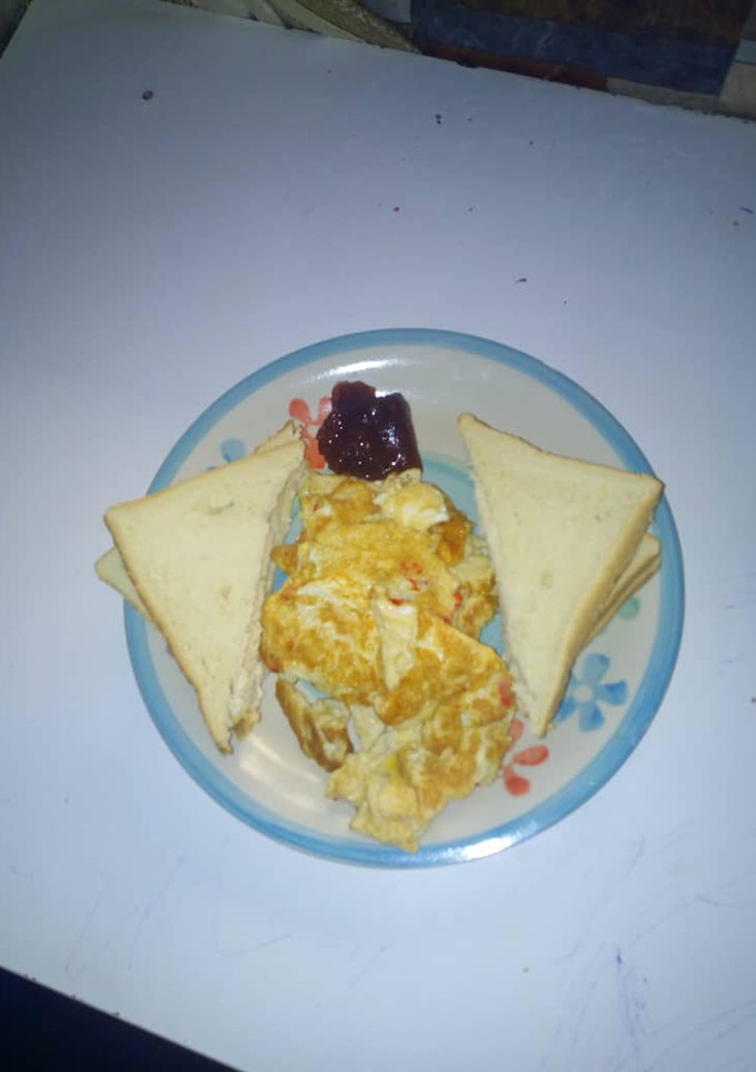 A picture of Bread and omellete with jam.