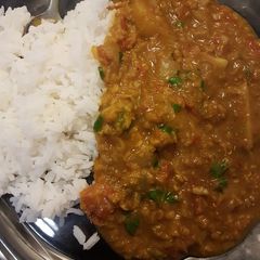 A picture of Masoor Dahl (Red Lentil Curry) with Rice.