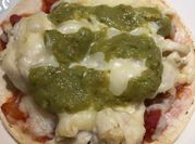 A picture of shredded chicken pizza