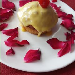 A picture of Eggless mawa cup cake topping with shrikhand.