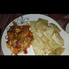 A picture of Fried Yam and chicken sauce.