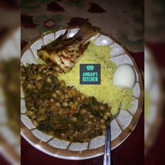 A picture of Yellow rice with beans porridge.