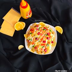 A picture of Cheese sauce loaded fries.