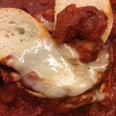 A picture of Baked Goat Brie in Spicy Garlic Tomato Sauce.