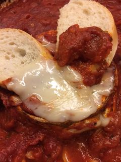 A picture of Baked Goat Brie in Spicy Garlic Tomato Sauce.
