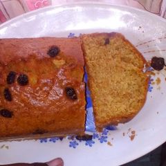 A picture of Carrot cake with raisins on top.