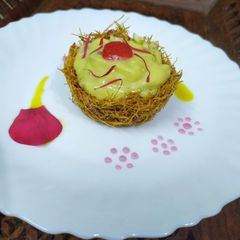 A picture of Vermicelli Basket With Mango Rabdi.