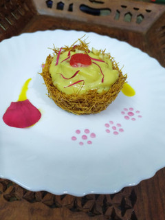 A picture of Vermicelli Basket With Mango Rabdi.