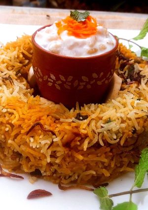 A picture of Shahi Mushroom and Baby Corn Biryani.