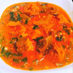 A picture of Stew sauce and vegetable with beef.