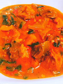 A picture of Stew sauce and vegetable with beef.