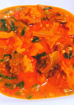 A picture of Stew sauce and vegetable with beef.