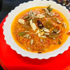 A picture of Gajar Halwa with almonds and cashews.
