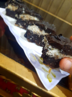 A picture of 3 layered coconut 🥥 brownie sticks.