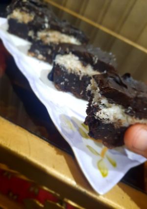 A picture of 3 layered coconut 🥥 brownie sticks.