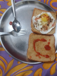 A picture of Half fry with bread.